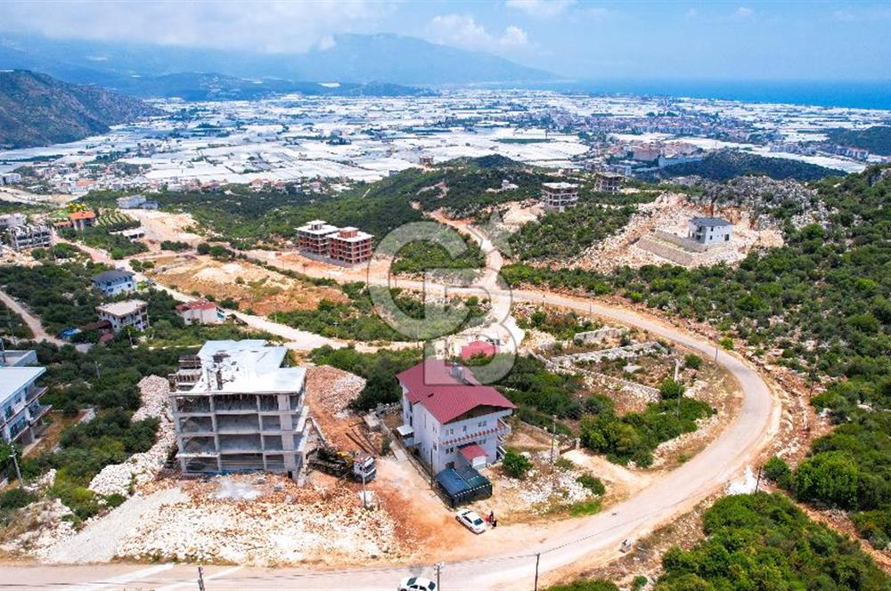 ANTALYA DEMRE BOZDAĞ'DA ÖNÜ KAPANMAZ DENİZ MANZARALI ARSA VE BİNASI