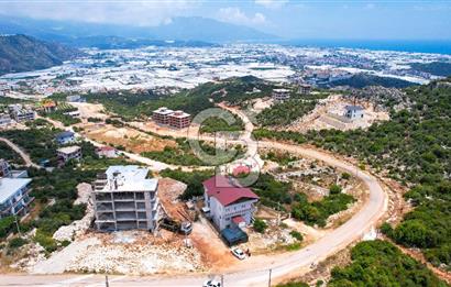 ANTALYA DEMRE BOZDAĞ'DA ÖNÜ KAPANMAZ DENİZ MANZARALI ARSA VE BİNASI