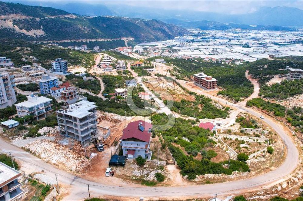 ANTALYA DEMRE BOZDAĞ'DA ÖNÜ KAPANMAZ DENİZ MANZARALI ARSA VE BİNASI