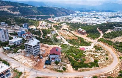 ANTALYA DEMRE BOZDAĞ'DA ÖNÜ KAPANMAZ DENİZ MANZARALI ARSA VE BİNASI