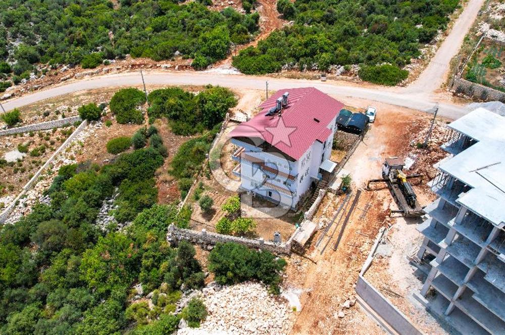 ANTALYA DEMRE BOZDAĞ'DA ÖNÜ KAPANMAZ DENİZ MANZARALI ARSA VE BİNASI