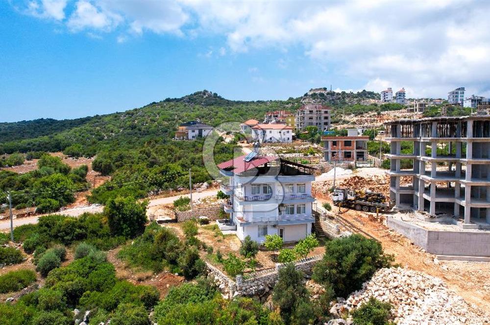 ANTALYA DEMRE BOZDAĞ'DA ÖNÜ KAPANMAZ DENİZ MANZARALI ARSA VE BİNASI