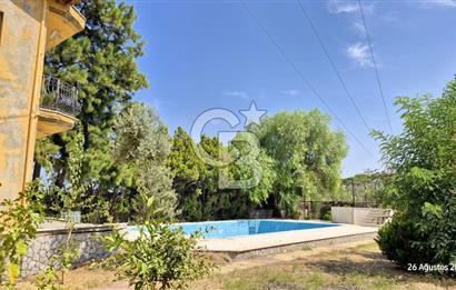 A CORNER OF HEAVEN IN THE KALABAK OF URLA, A HOUSE IN A FIELD