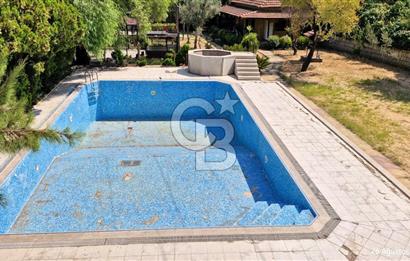 A CORNER OF HEAVEN IN THE KALABAK OF URLA, A HOUSE IN A FIELD