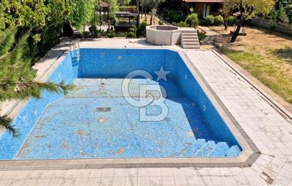 A CORNER OF HEAVEN IN THE KALABAK OF URLA, A HOUSE IN A FIELD