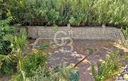 A CORNER OF HEAVEN IN THE KALABAK OF URLA, A HOUSE IN A FIELD