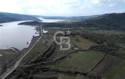 ÇANAKKALE AYVACIK KÜÇÜKHUSUN KÖYÜNDE ETRAFI ÇEVRİLİ 9.140 m²﻿﻿﻿ SATILIK ARAZİ