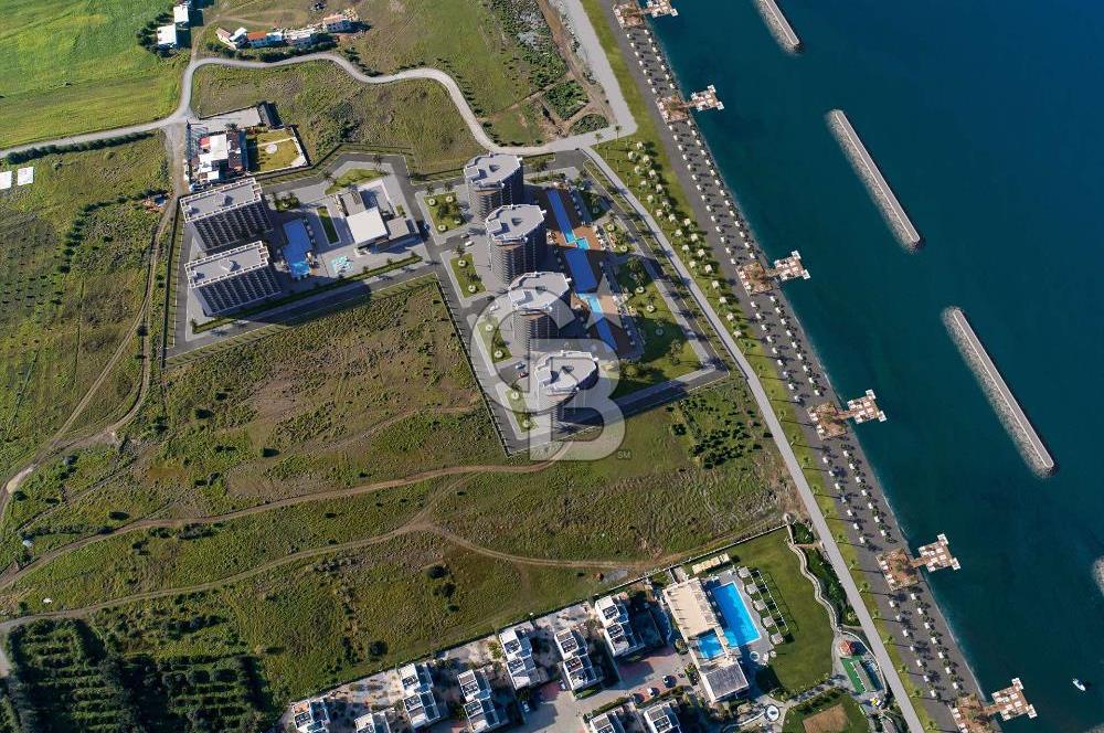 KKTC Lefke de Türk Tapulu Dedeman Hotel  İşletme  Garantisi ile Denize Sıfır Ful Eşyalı 1+1 Daireler