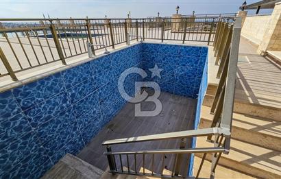 Kuşadası Karaova havuzlu sitede eşyasız kiralık triplex villa