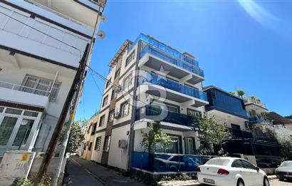Bayraklı Merkezde Satılık Komple Bina Teraslı Deniz Manzaralı