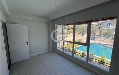 YENİFOÇA OLİVEPARK EVLERİ'NDE HAVUZLU SİTEDE 2+1 SATILIK DAİRE
