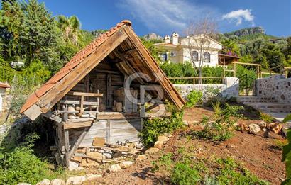 Fethiye Faralya’da Satılık Yüksek Gelir Getiren Doğanın İçinde Yatırımlık Butik Otel 