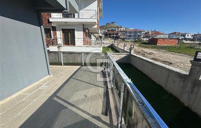 Foça Bağarası'nda Satılık 2+1 Bahçe Katı Daire