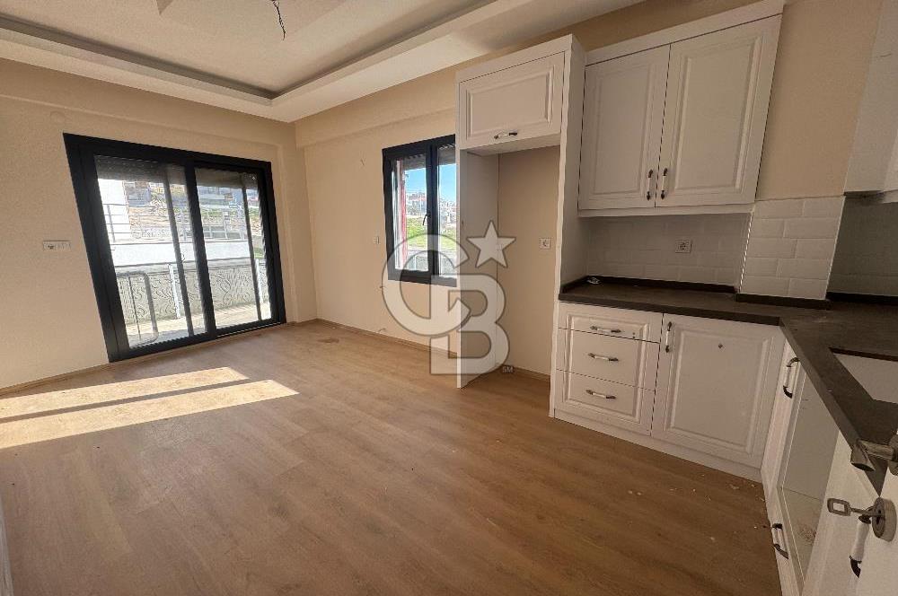 Foça Bağarası'nda Satılık 2+1 Bahçe Katı Daire