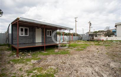 Foça Bağarası Hacıveli'de Satılık 2+1 Prefabrik ve Tarla