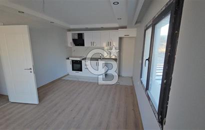 YENİ FOÇA DA SATILIK HAVUZLU SİTEDE 1+1 SATILIK DAİRE