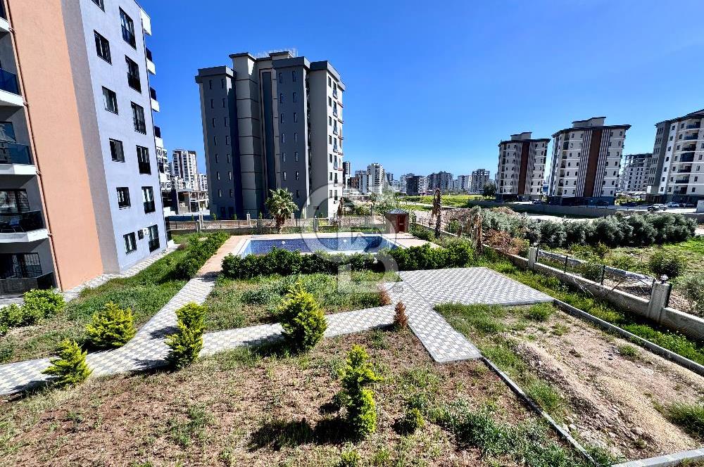 MEZİTLİ KUYULUK MAH. HAVUZLU SİTE İÇERİSİNDE SATILIK 1+1 DAİRE