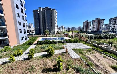 MEZİTLİ KUYULUK MAH. HAVUZLU SİTE İÇERİSİNDE SATILIK 1+1 DAİRE