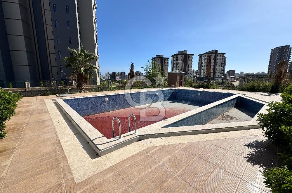 MEZİTLİ KUYULUK MAH. HAVUZLU SİTE İÇERİSİNDE SATILIK 1+1 DAİRE