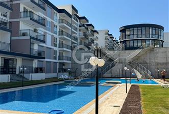 KUŞADASINDA DOĞA İLE İÇ İÇE HARİKA PROJEDE SATILIK 1+1 GİRİŞ KATI DAİRE