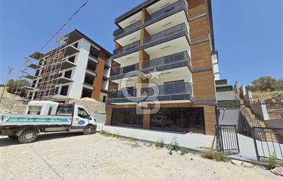 Kuşadası’nın Gelişen Bölgesi Kirazlı Yolu Üzerinde, Cadde Cepheli, Yüksek Tabela Değerine Sahip Sıfır Dükkan Fırsatı!