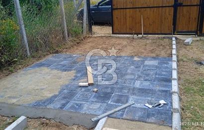 KEMALPAŞA CUMALİ DA İCİNDE EV BULUNAN SATILIK ZEYTİNLİ TARLA