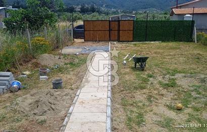 KEMALPAŞA CUMALİ DA İCİNDE EV BULUNAN SATILIK ZEYTİNLİ TARLA