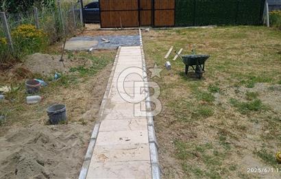 KEMALPAŞA CUMALİ DA İCİNDE EV BULUNAN SATILIK ZEYTİNLİ TARLA