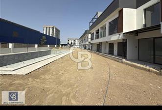 GARDEN BORNOVA BÜYÜK BAHÇELİ HAVUZLU SPOR SALONLU 1+1 DAİRE