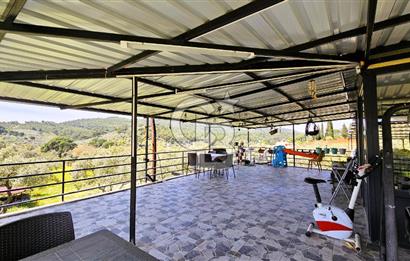 TORBALI ORMANKÖY'DE İÇİNDE 200 m2 EV OLAN SATILIK 7 DÖNÜM TARLA
