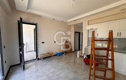 GÜRE ÇAMLIBELDE BAHÇE KULLANIMLI HAVUZLU SATILIK 1+1 DAİRE