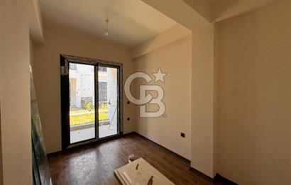 GÜRE ÇAMLIBELDE BAHÇE KULLANIMLI HAVUZLU SATILIK 1+1 DAİRE