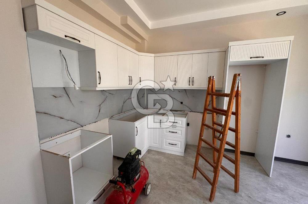 GÜRE ÇAMLIBELDE BAHÇE KULLANIMLI HAVUZLU SATILIK 1+1 DAİRE