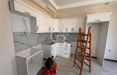 GÜRE ÇAMLIBELDE BAHÇE KULLANIMLI HAVUZLU SATILIK 1+1 DAİRE