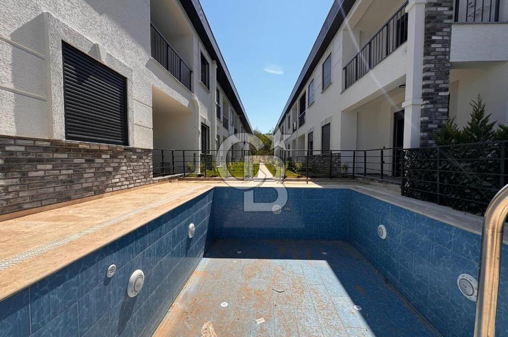 GÜRE ÇAMLIBELDE BAHÇE KULLANIMLI HAVUZLU SATILIK 1+1 DAİRE