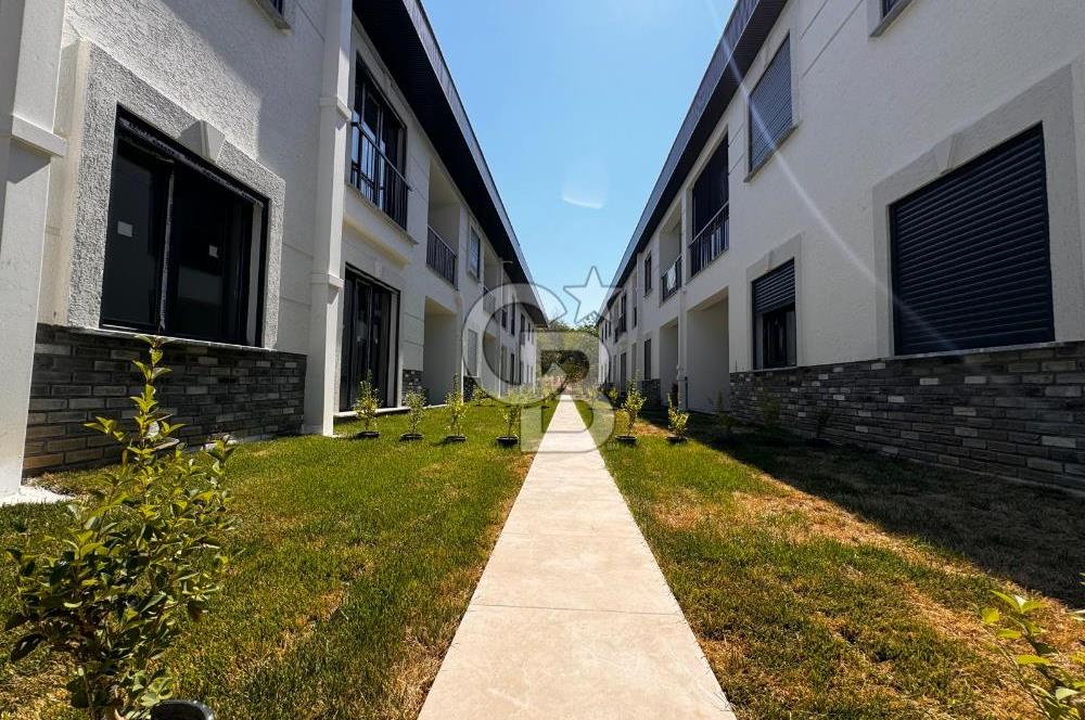 GÜRE ÇAMLIBELDE BAHÇE KULLANIMLI HAVUZLU SATILIK 1+1 DAİRE