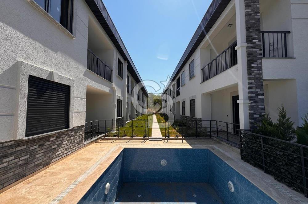 GÜRE ÇAMLIBELDE BAHÇE KULLANIMLI HAVUZLU SATILIK 1+1 DAİRE