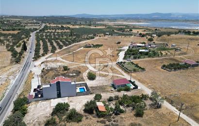 DİKİLİ ÇANDARLI’DA ANAYOLA KOMŞU SATILIK YATIRIMLIK ARSA