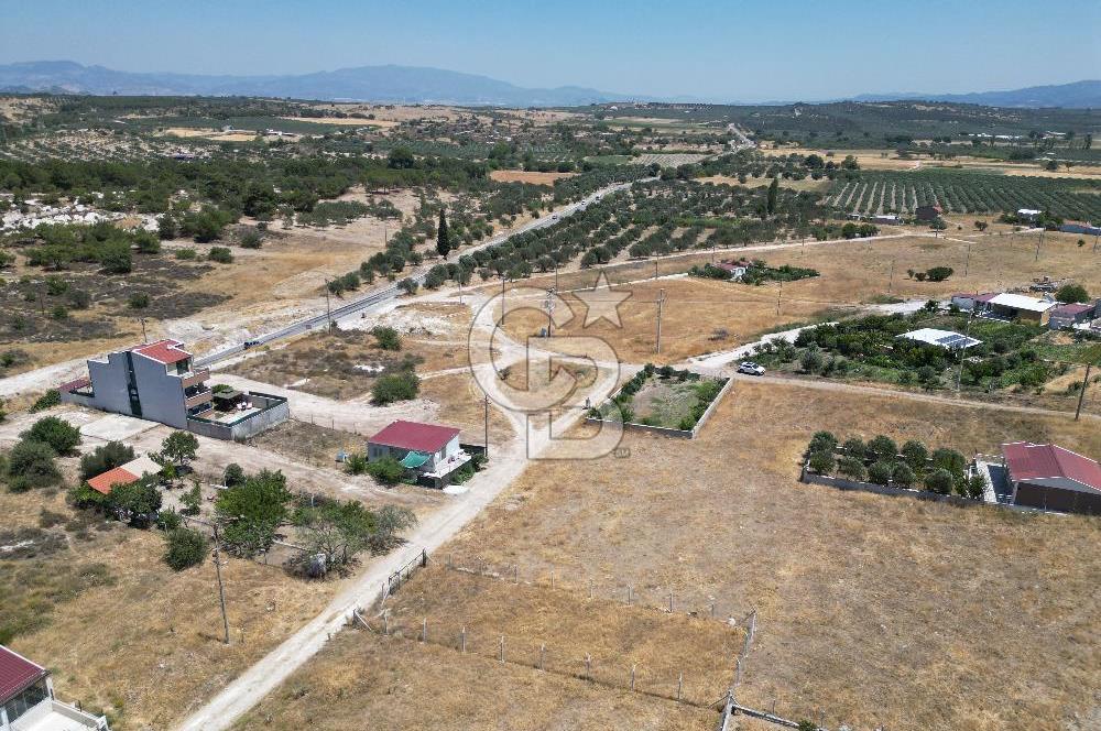 DİKİLİ ÇANDARLI’DA ANAYOLA KOMŞU SATILIK YATIRIMLIK ARSA