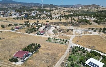 DİKİLİ ÇANDARLI’DA ANAYOLA KOMŞU SATILIK YATIRIMLIK ARSA