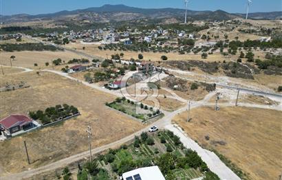 DİKİLİ ÇANDARLI’DA ANAYOLA KOMŞU SATILIK YATIRIMLIK ARSA