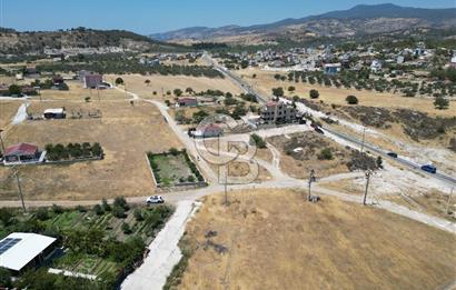 DİKİLİ ÇANDARLI’DA ANAYOLA KOMŞU SATILIK YATIRIMLIK ARSA
