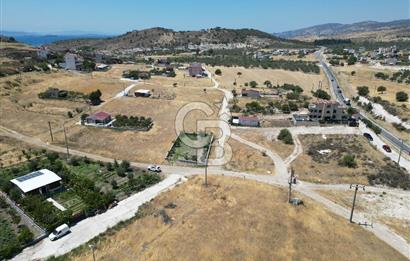 DİKİLİ ÇANDARLI’DA ANAYOLA KOMŞU SATILIK YATIRIMLIK ARSA