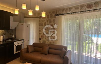 CB Giz'den Kalkan Kalamarda 1+1 ortak havuzlu site icinde daire