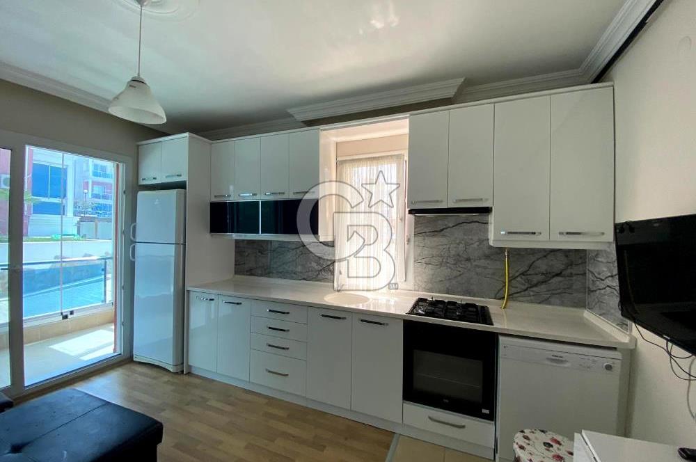 İZMİR BAYRAKLI OSMANGAZİ GÜNEŞKENT SİTESİ'NDE SATILIK 1+1 DAİRE