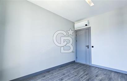 KUŞADASI MERKEZDE K.OTOPARKLI GÜVENLİKLİ HAUZLU YENİ 2+1 DAİRE 