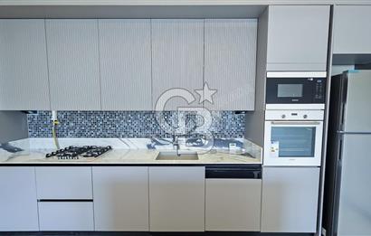 KUŞADASI MERKEZDE K.OTOPARKLI GÜVENLİKLİ HAUZLU YENİ 2+1 DAİRE 