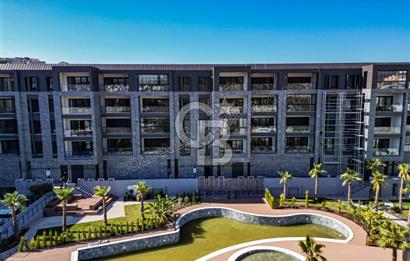 KUŞADASI MERKEZDE K.OTOPARKLI GÜVENLİKLİ HAUZLU YENİ 2+1 DAİRE 