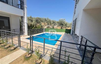 GÜRE ÇAMLIBELDE BAHÇE KULLANIMLI HAVUZLU SATILIK 1+1 DAİRE
