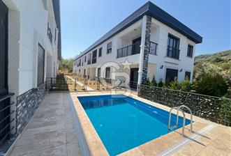 GÜRE ÇAMLIBELDE BAHÇE KULLANIMLI HAVUZLU SATILIK 1+1 DAİRE